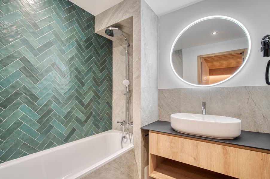 1 bathtub and a separate toilet